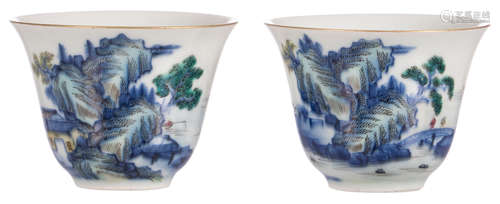 Two Chinese blue and white polychrome decorated cups with figures in a mountainous river landscape, marked Guangxu, 19thC, H 5 - ø 6,5 cm