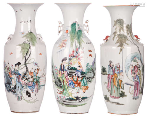 Three Chinese polychrome decorated vases, two vases with playing children in a garden and calligraphic texts, one vase with an animated scene and calligraphic texts, H 59 cm