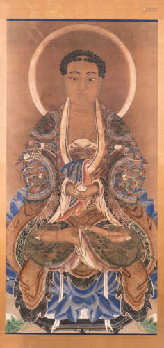 A Chinese scroll, textile on paper, with silk mount, framed, depicting the Sakamuni Buddha, gouache, 18th - 19thC, 77 x 155 (without mount) - 85 x 177 cm (with mount)