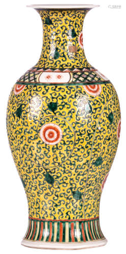 A Chinese yellow ground polychrome floral decorated baluster shaped vase, H 46 cm