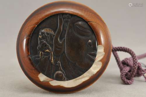 Kagamibuta Netsuke. Japan. 19th century. Bronze with