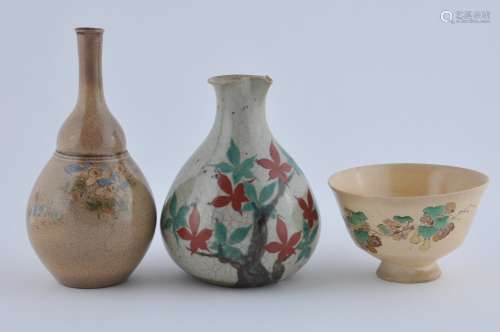 Three pieces of pottery. Japan. 19th century. Two sake