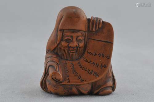 Carved wooden Netsuke. Japan. 19th century. Figure of