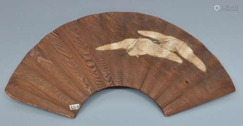 Carved wooden ornament in the form of a fan with a pair