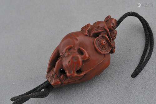 Carved fruit pit. China. 19th century. Boy on the back