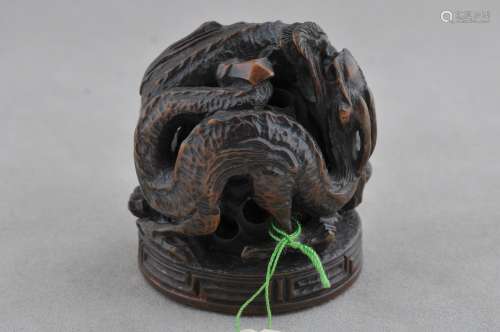Carved wooden Netsuke. Japan. 19th century. Seal form