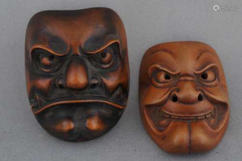 Lot of two wooden Netsuke. Japan. 19th century. Masks