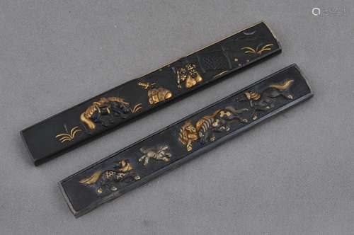 Two Kodzuda hilts. Japan. 18th century. Mixed metal