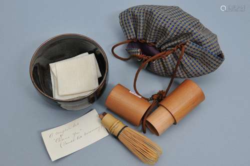 Tea set. Japan. 19th century. Temoku tea bowl, brocade