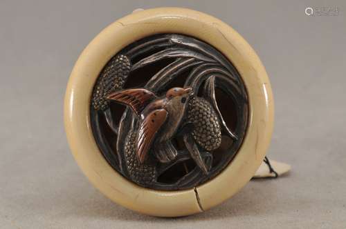 Kagamibuta Netsuke. Japan. 19th century. Mixed metal