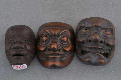 Lot of three wooden mask Netsukes. Japan. 18th/19th