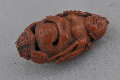 Carved fruit pit. China. 19th century. Figure of Liu