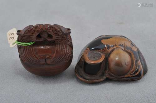 Two carved wooden Netsukes. Japan. 19th century. A