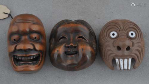 Lot of three mask Netsukes. Japan. 19th century. Two of