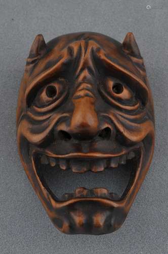 Wooden Netsuke. Japan. 19th century. Mask of an