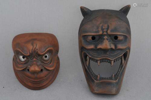 Lot of two wooden Netsuke. Japan. 19th century. Masks.