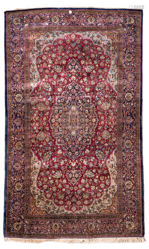 An Oriental floral decorated silk rug with central medaillon, Isfahan, 131 x 206 cm