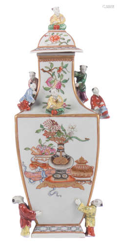 A quadrangular baluster shaped vase, relief decorated all over with Hé-Hé children and painted with chinoiseries in a famille rose palet, H 34 cm