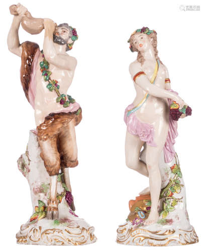 A polychrome decorated Bacchus figure flanked by a Bacchante, with a Meissen mark, H 36 cm