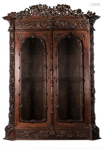 A richly carved oak cabinet, possibly French, late 19thC, H 250 - W 189 - D 78 cm