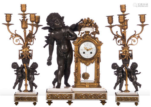 A Neoclassical zamac and gilt bronze three-piece garniture on a white marble base, marked 'S.H. - Paris', H 53,5 cm