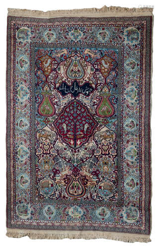 An Oriental rug, floral decorated, the roundels with various animals and a calligraphic text, wool on cotton, 125 x 182 cm