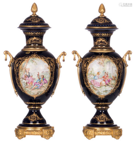 Two vases of the Sèvres type, bleu royal ground, the roundels decorated with scenes after Boucher, gilt bronze mounts, H 60 cm