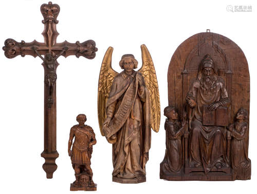 An oak alto relievo, depiciting three saints, 19thC; added an oak sculpture, depicting David and Goliath; extra added an oak angel, gilt wings and banderole with inscription; extra added a Gothic Revival crucifix with a cast iron corpus, H 38 - 133 cm