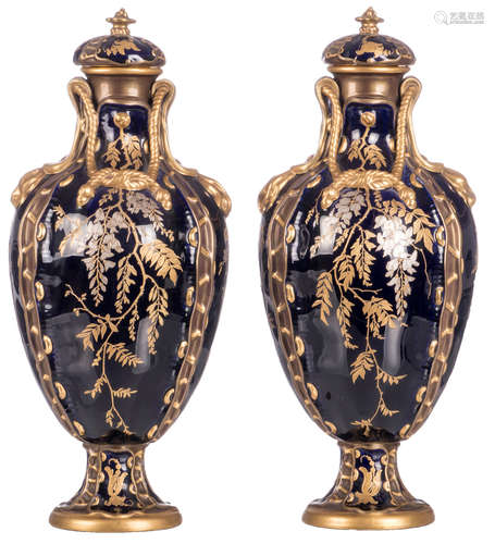 A pair of decorative Art Nouveau vases and covers with a Japonism decoration, presumably produced by Sarreguemines, sold and labeled by the Brussels - Vermeiren Coché manufactory, H 45 cm