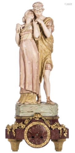 The lovers, a polychrome decorated biscuit figure, marked 'Royal Dux', on a rouge impérial marble mantel clock with gilt bronze mounts, H 46,5 cm