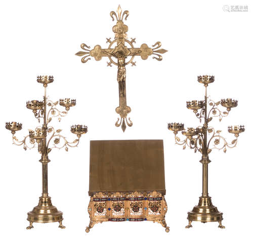 A pair of Gothic Revival brass candelabras, a ditto crucifix, and a ditto lectern inlaid with cloisonné enamel and cabochon cut glass beads, H 54 - 65 cm