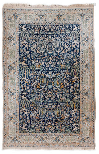 An Oriental rug decorated with various animals and floral motifs, wool on cotton, 150 x 237,5 cm