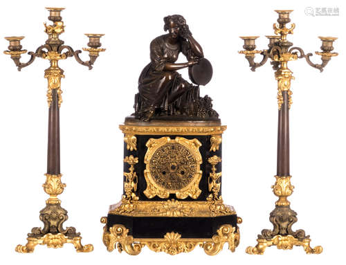 A gilt and patinated bronze three-piece garniture, the body of the clock in Rance marble and on top an allegory of summer, H 57 cm