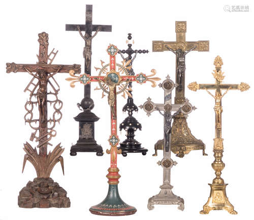 Seven crucifixes, wood, brass, bronze, silver, nickel and silver plated, 19th - 20thC, H 50 - 68 cm