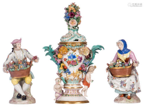 A small potpourri in polychrome decorated porcelain, with a Meissen mark; added a pair of ditto figures of the 'Cris de Paris' type, marked, H 20,5 - 33,5 cm