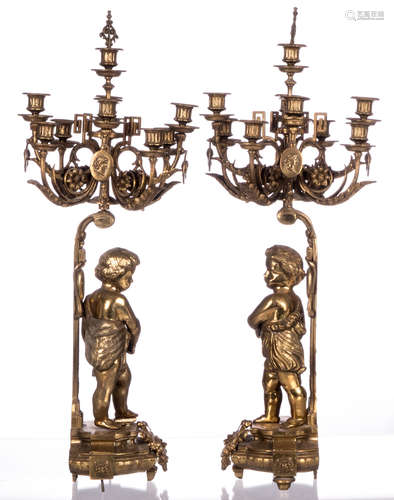 A pair of bronze candelabras, 20thC copy, H 84 cm