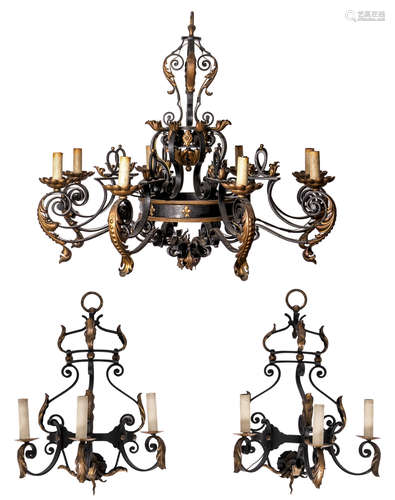 A wrought-iron eigth-light chandelier with some gilt ornamental parts, added two matching wall appliques, H 91 - ø 106 cm