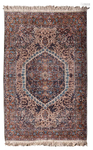 An Oriental floral decorated rug with central roundel, 142 x 224 cm