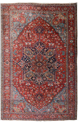 A large Oriental rug with floral and geometric motifs, wool on cotton, 397 x 622 cm