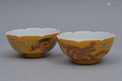 Pair of porcelain bowls. China. 20th century. Scalloped edge. Decoration of dragons and phoenixes on a yellow ground. Kuang Hsu marks. 4