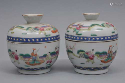 Pair of porcelain covered bowls. China. 19th century. Famille Rose decoration of children playing. Tung Chih mark. 4-1/2