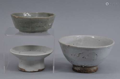 Three Korean ceramics. To include: A 12th century hexagonal celadon bowl with sangam inlay and two Yi pieces, a bowl and an offering stand. 4-1/2