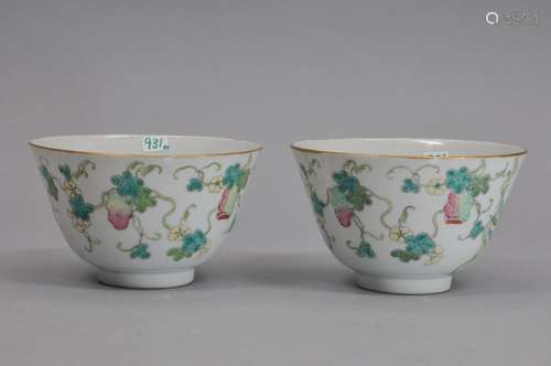 Pair of porcelain bowls, China. Kuang Hsu mark (1875-1908) and of the period. Decoration of fruit, flowers, bamboo, and butterflies. 4 1/2