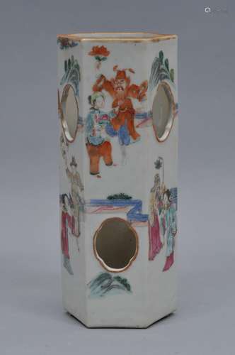 Porcelain hat stand. China. 19th century. Hexagonal form with pierced openings. Famille Rose decoration of figures with flowers. 12