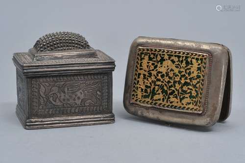 Lot of two silver boxes. India. 19th century. A nutmeg grater and a card case with inset panel of gold and green enamel. Each about 2-1/2