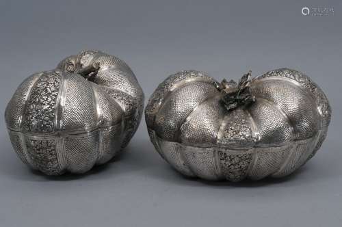 Pair of silver boxes. Cambodia. 20th century. Repousse work. Melon shaped with panels of floral scrolling. 11