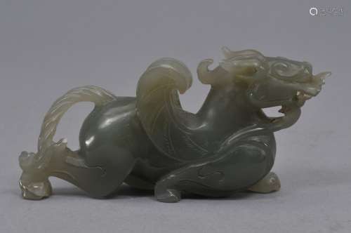 Jade carving. China. 20th century. Grey green carving of a horned mythical animal. 4-3/4