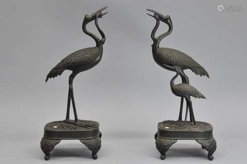 Pair of bronze candle prickets. Japan. Meiji period (1868-1912). Bronze cranes. Loss to one, missing smaller bird. 16