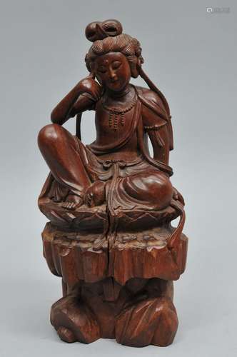 Carved wooden Buddha. China. 19th century. Figure of the water moon viewing Kuan Yin. 15