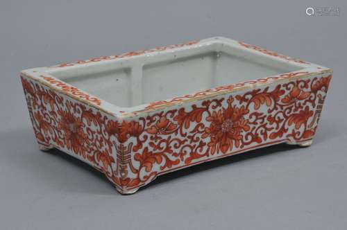 Porcelain planter. China. 19th century. Rectangular form. Iron red decoration of floral scrolling. Yung Cheng mark on base. 7-3/4